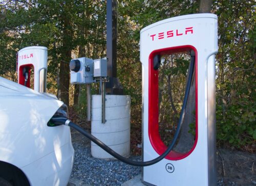 Tesla supercharger at a charging station.